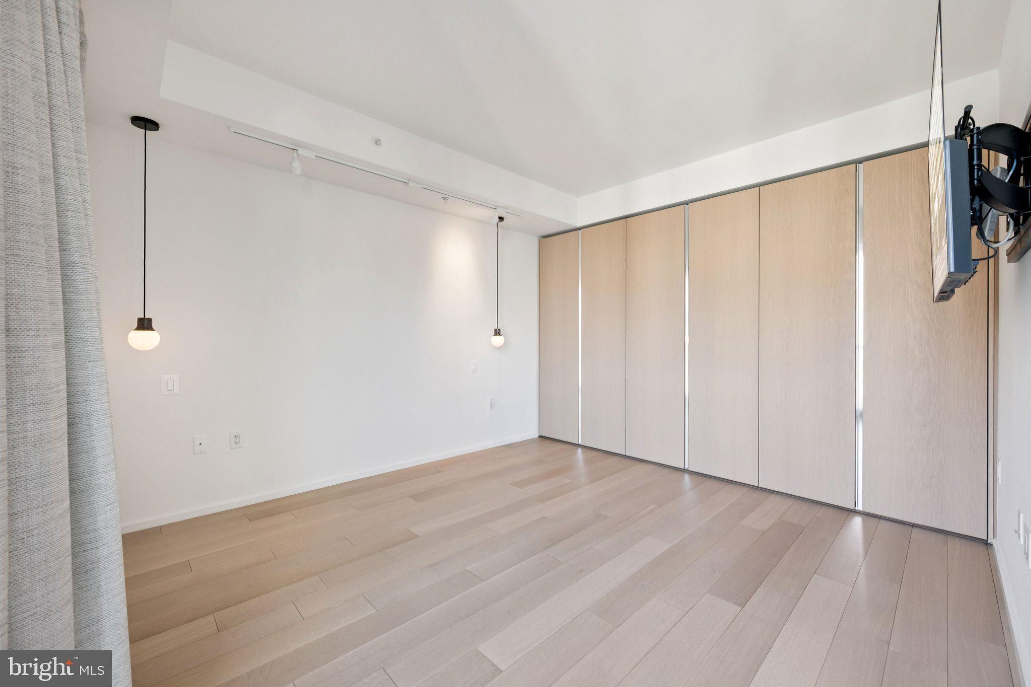 925 H Street Northwest, Unit 903 Washington, DC 20001 - Photo 16 of 36 a view of an empty room