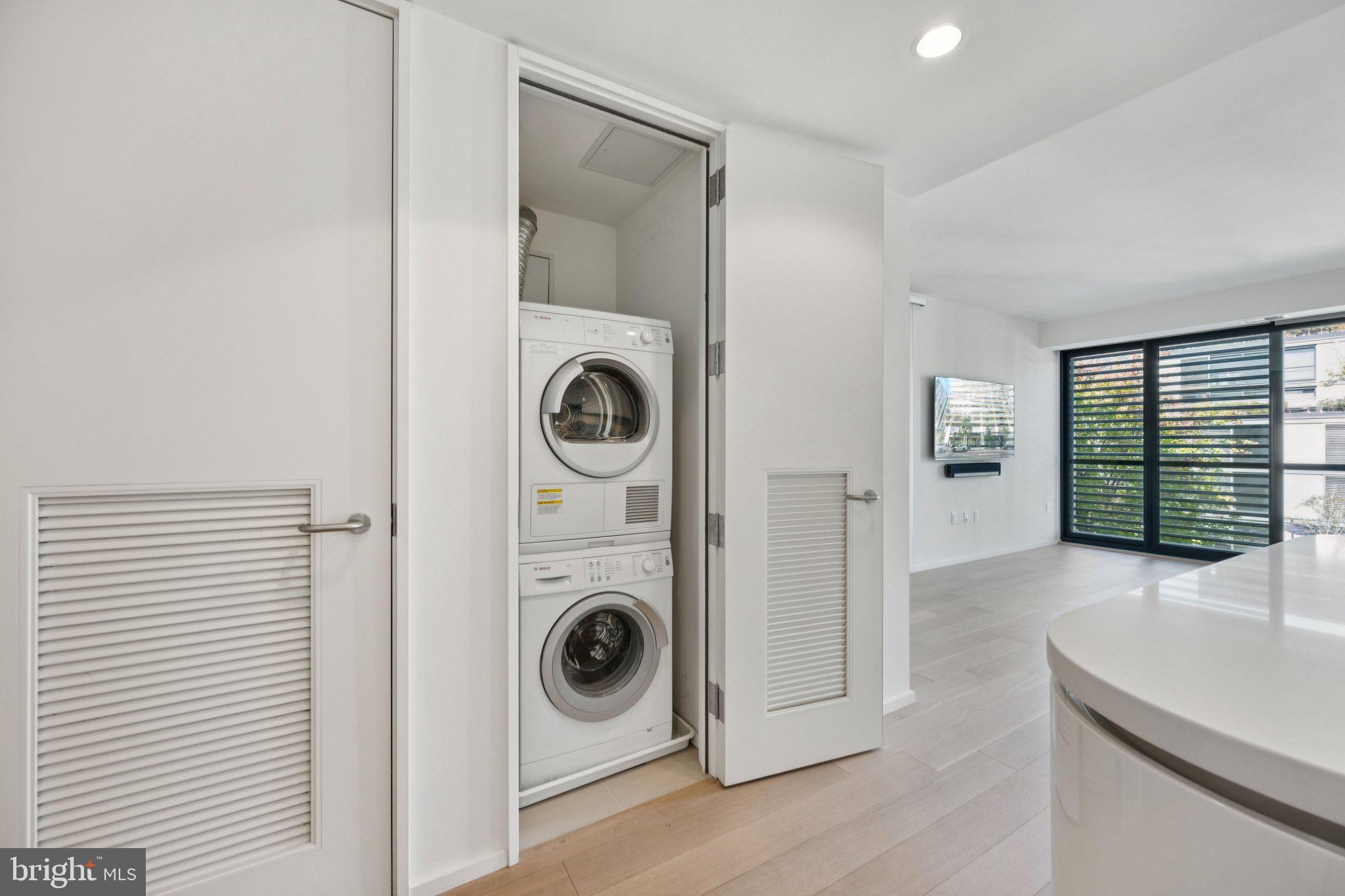 925 H Street Northwest, Unit 903 Washington, DC 20001 - Photo 20 of 36 a view of a storage and utility room with washer and dryer