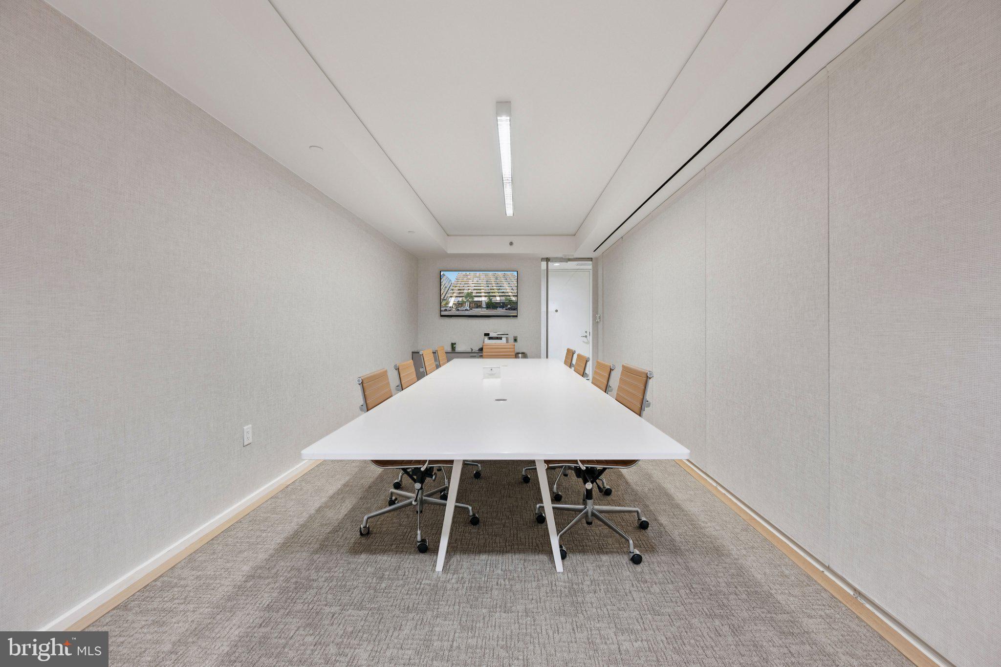 925 H Street Northwest, Unit 903 Washington, DC 20001 - Photo 26 of 36 a view of a hallway with a table and chairs