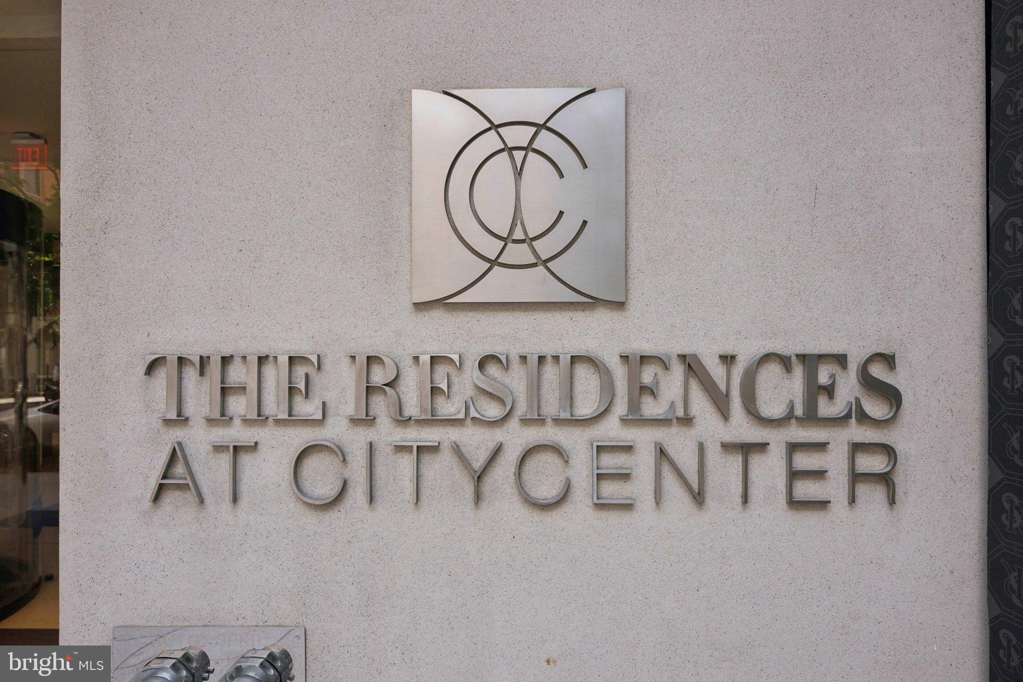 925 H Street Northwest, Unit 903 Washington, DC 20001 - Photo 30 of 36 a white cabinet with a black white bedspread and pillows