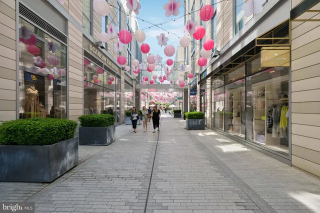 a view of a building with sitting area and furniture