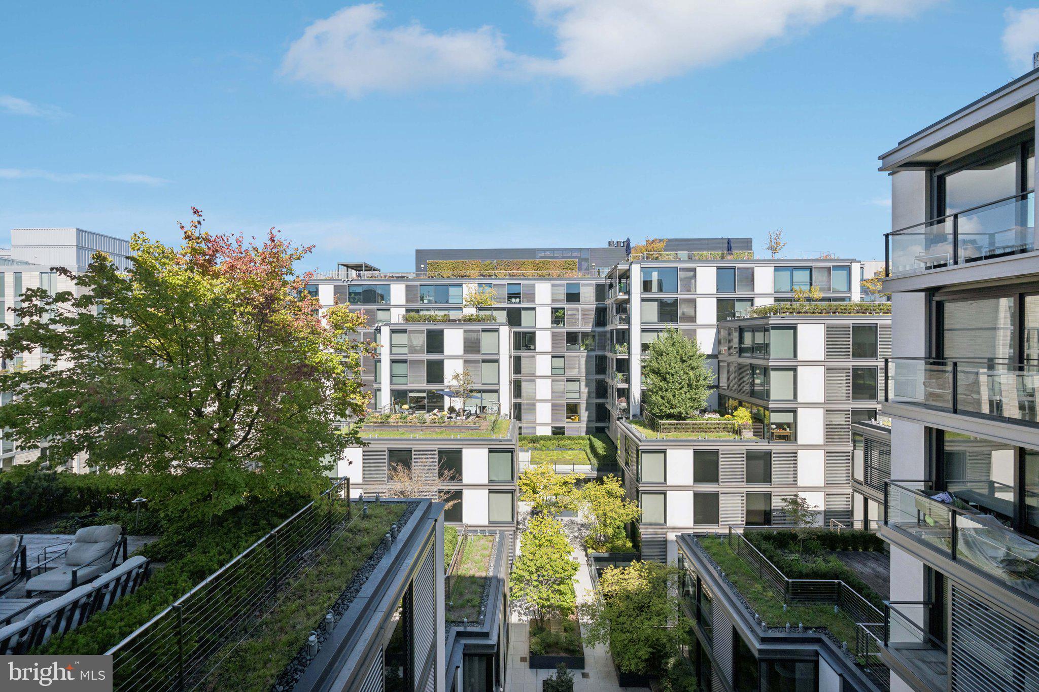 925 H Street Northwest, Unit 903 Washington, DC 20001 - Photo 36 of 36 a front view of a residential apartment building with a yard