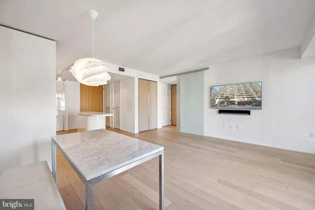 a view of a kitchen cabinets and wooden floor