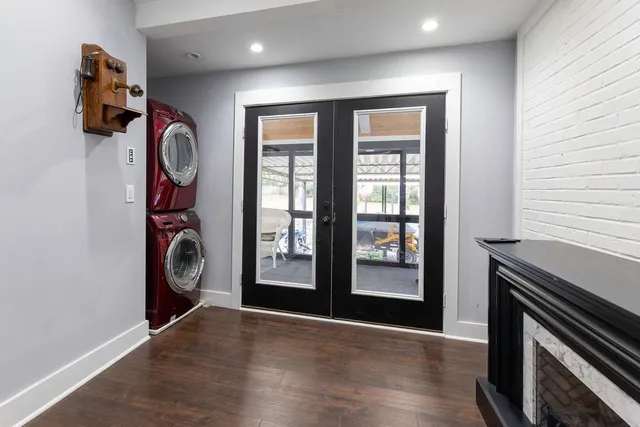 a view of an entryway with wooden floor