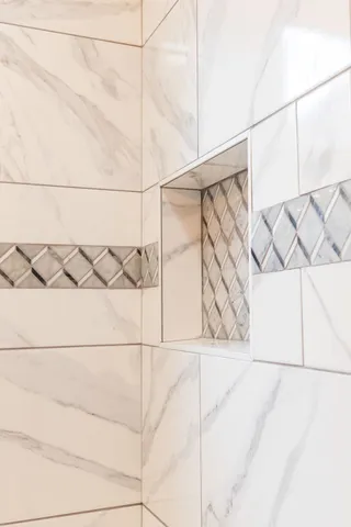 a bathroom with a bathtub and shower