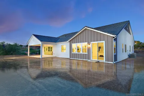a view of livingroom with swimming pool and yard