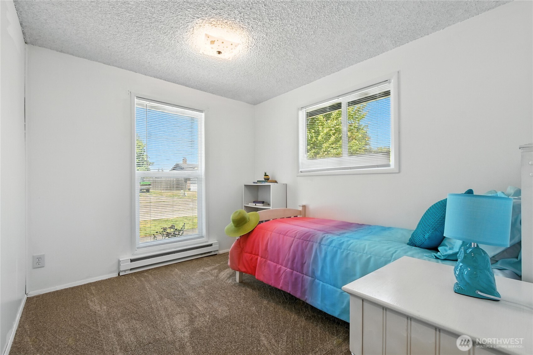 2102 35th Avenue Longview, WA 98632 - Photo 21 of 31 a bedroom with two beds and a window