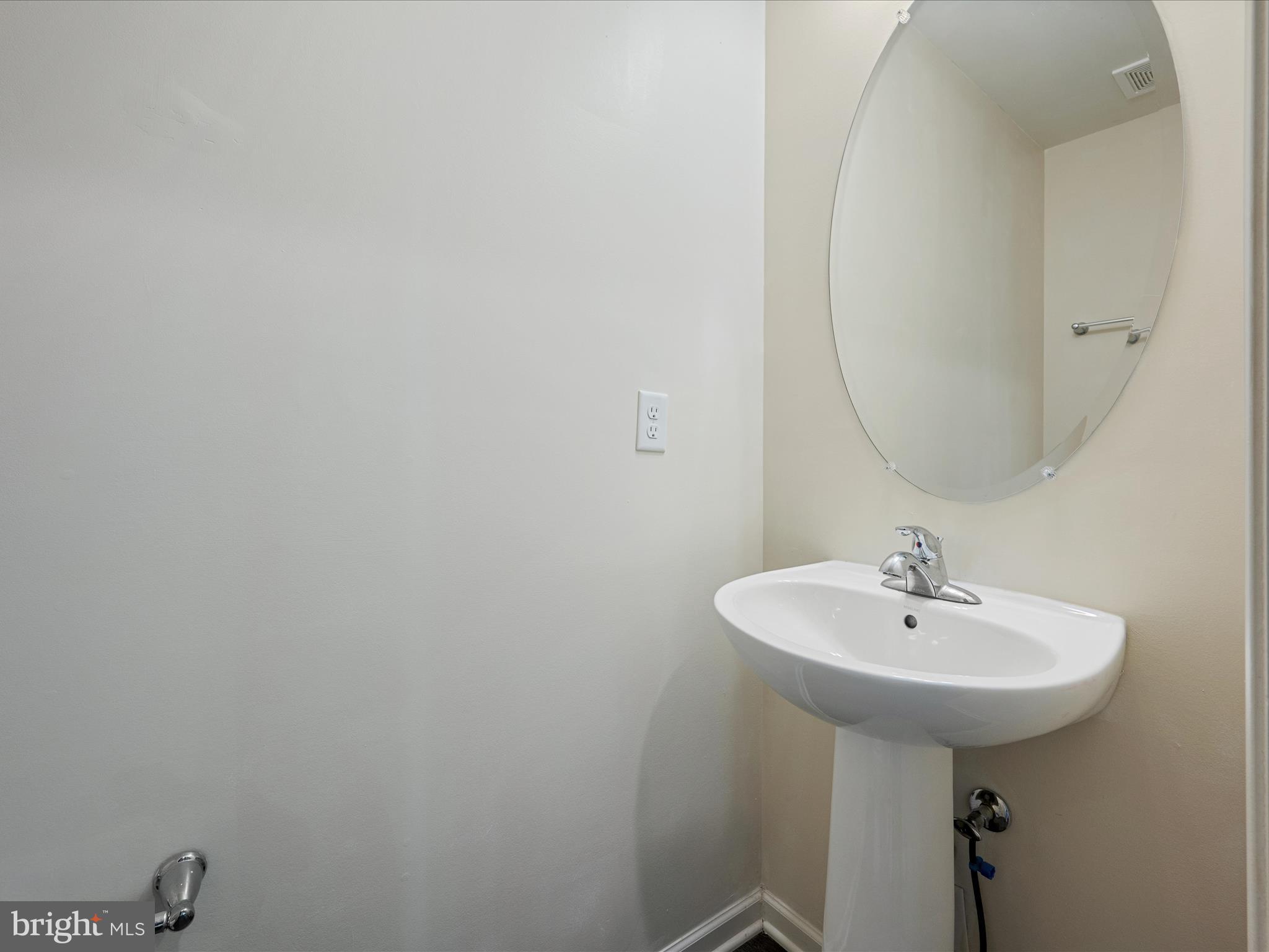 640 Thumper Drive Ranson, WV 25438 - Photo 19 of 50 a bathroom with a sink and a mirror