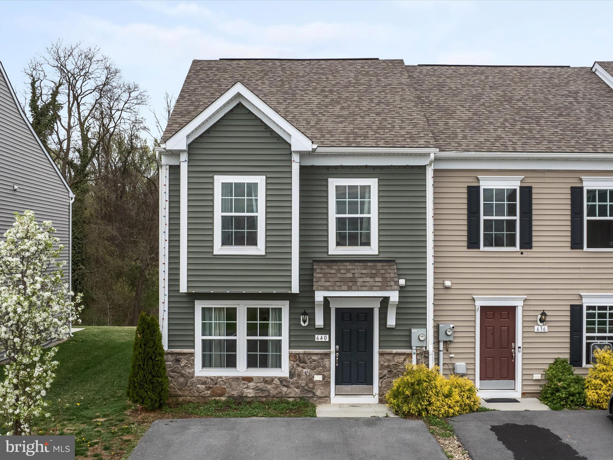 640 Thumper Drive Ranson, WV 25438 - Photo 2 of 50 a view of a house with a yard and large tree