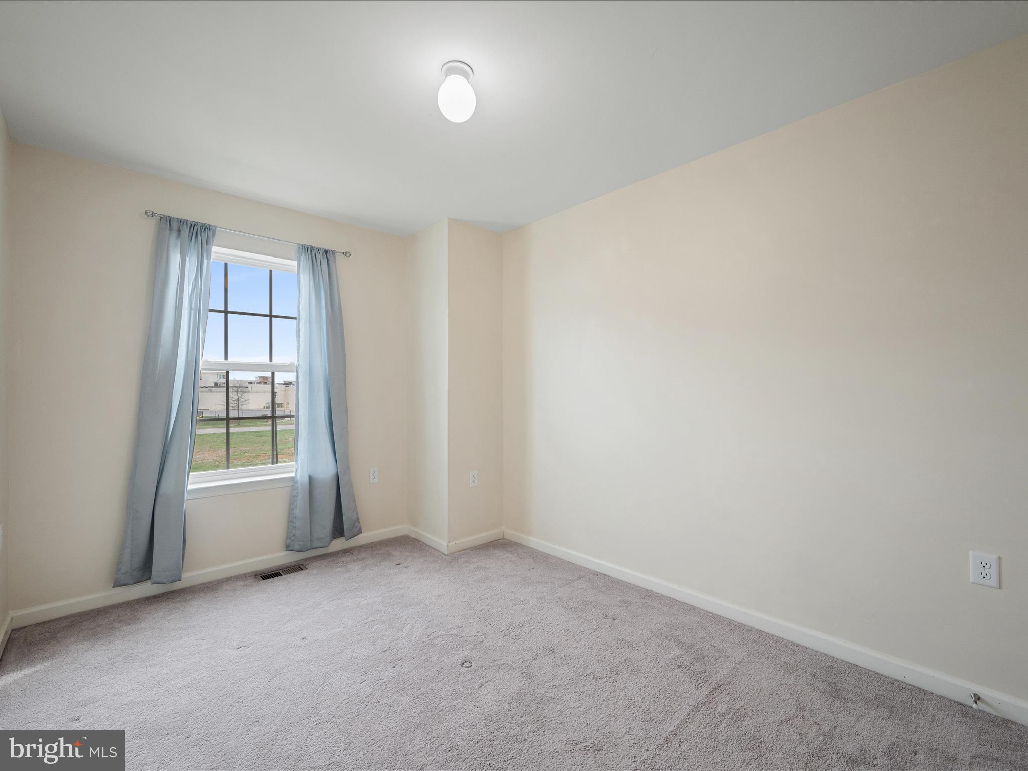 640 Thumper Drive Ranson, WV 25438 - Photo 26 of 50 an empty room with windows