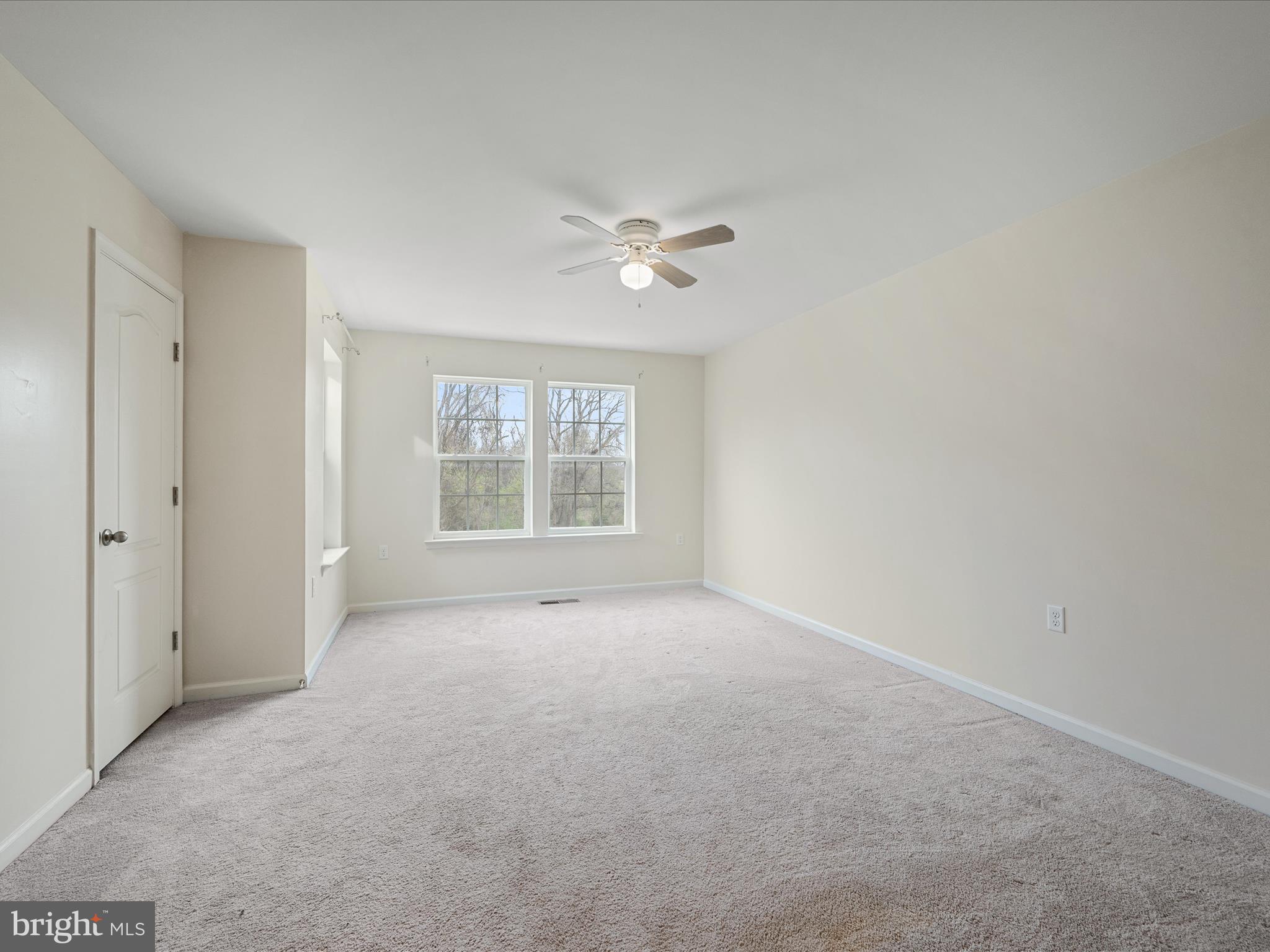 640 Thumper Drive Ranson, WV 25438 - Photo 28 of 50 wooden floor in an empty room with a window
