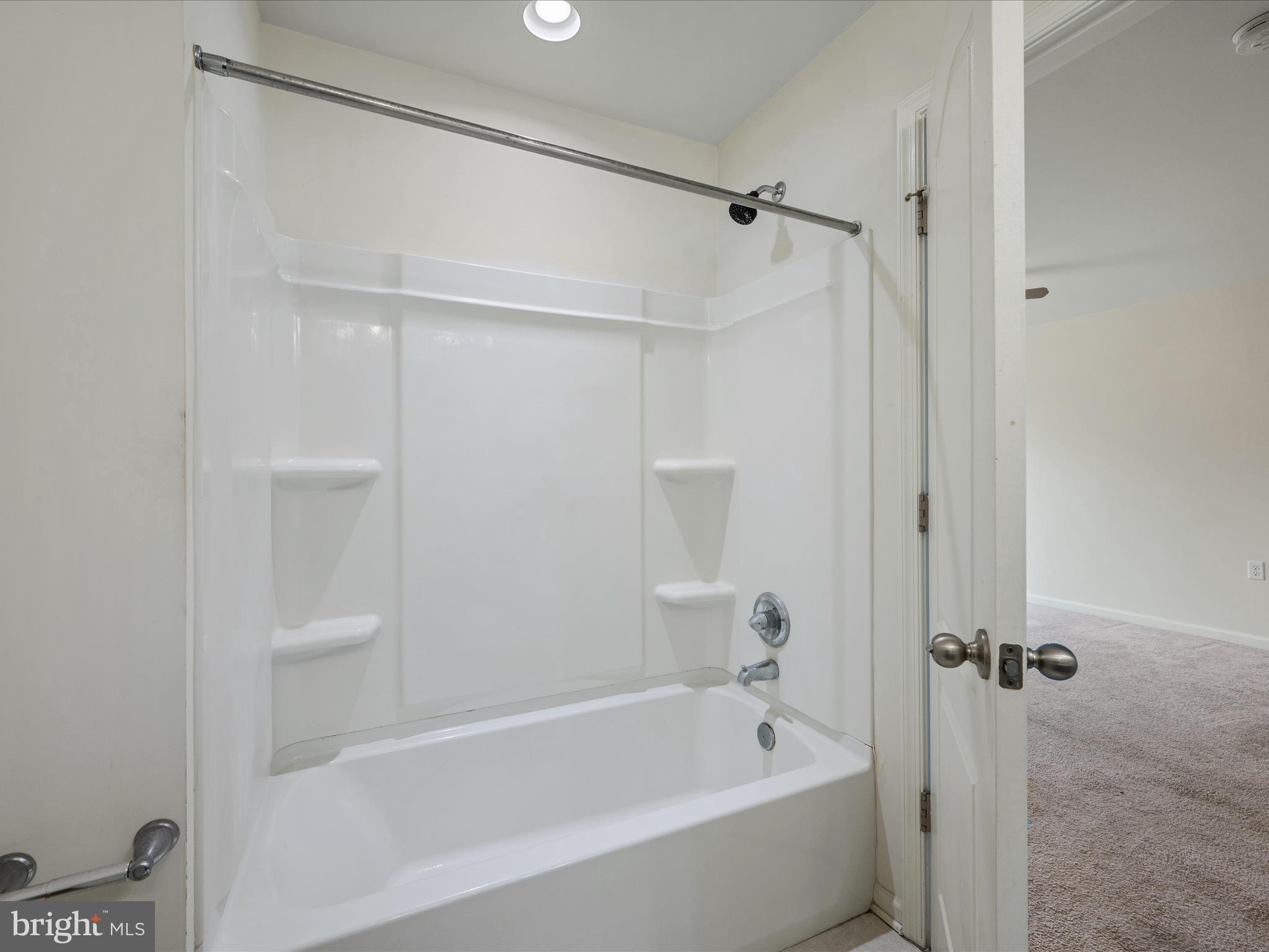 640 Thumper Drive Ranson, WV 25438 - Photo 32 of 50 a bathroom with a bathtub and a shower