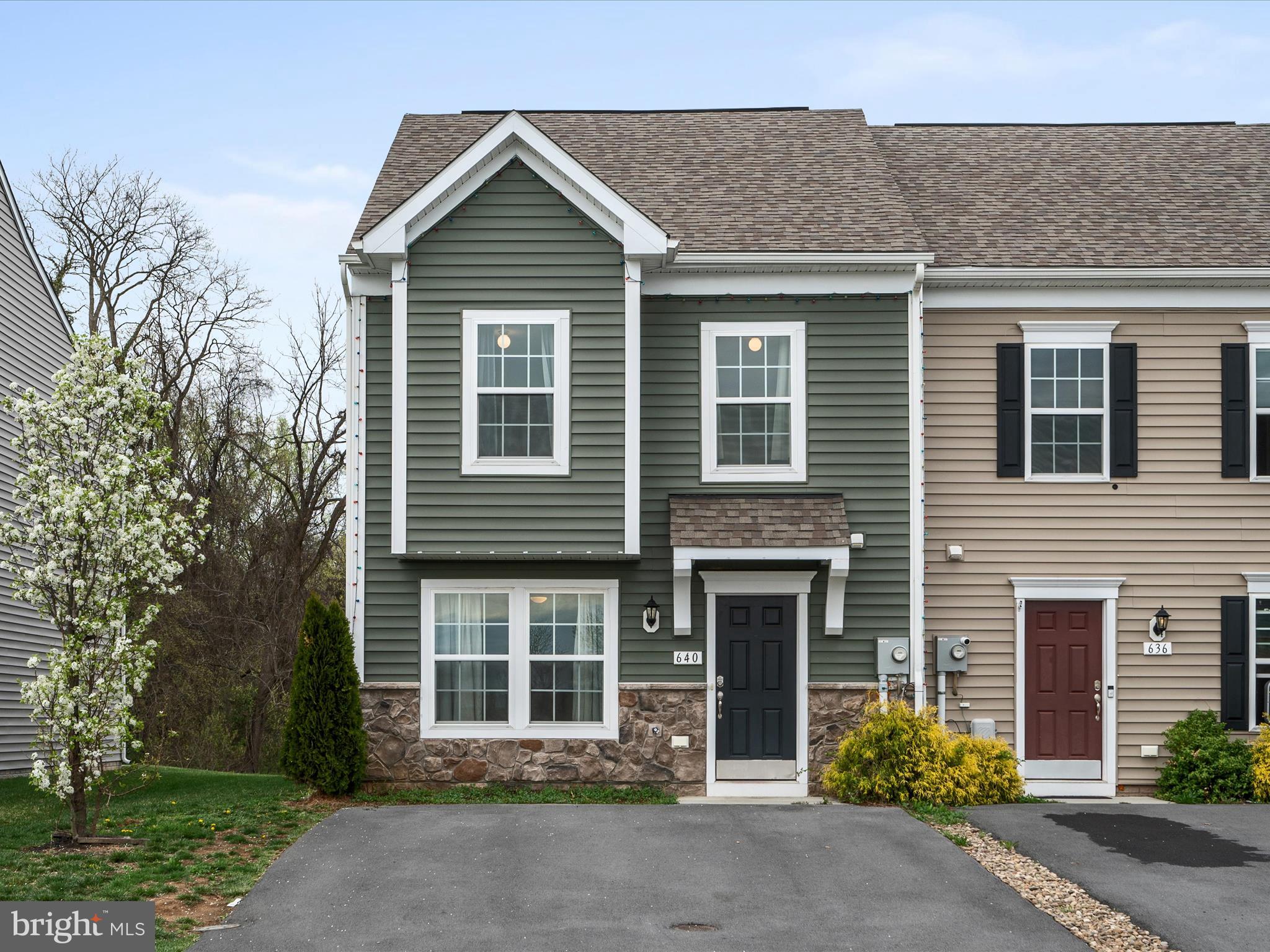 640 Thumper Drive Ranson, WV 25438 - Photo 4 of 50 a front view of a house with a yard and garage