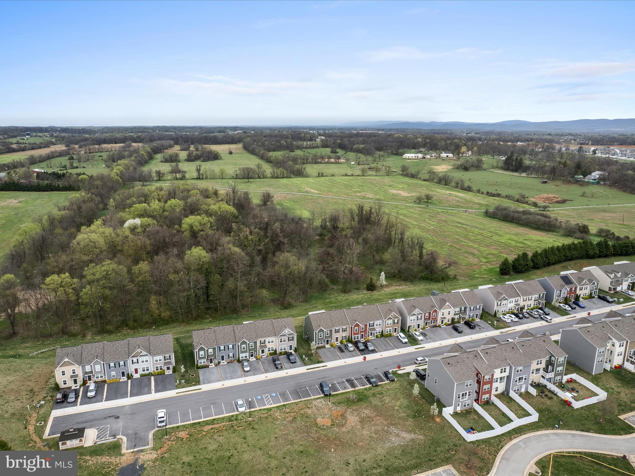 640 Thumper Drive Ranson, WV 25438 - Photo 42 of 50 an aerial view of a house with a yard and lake view