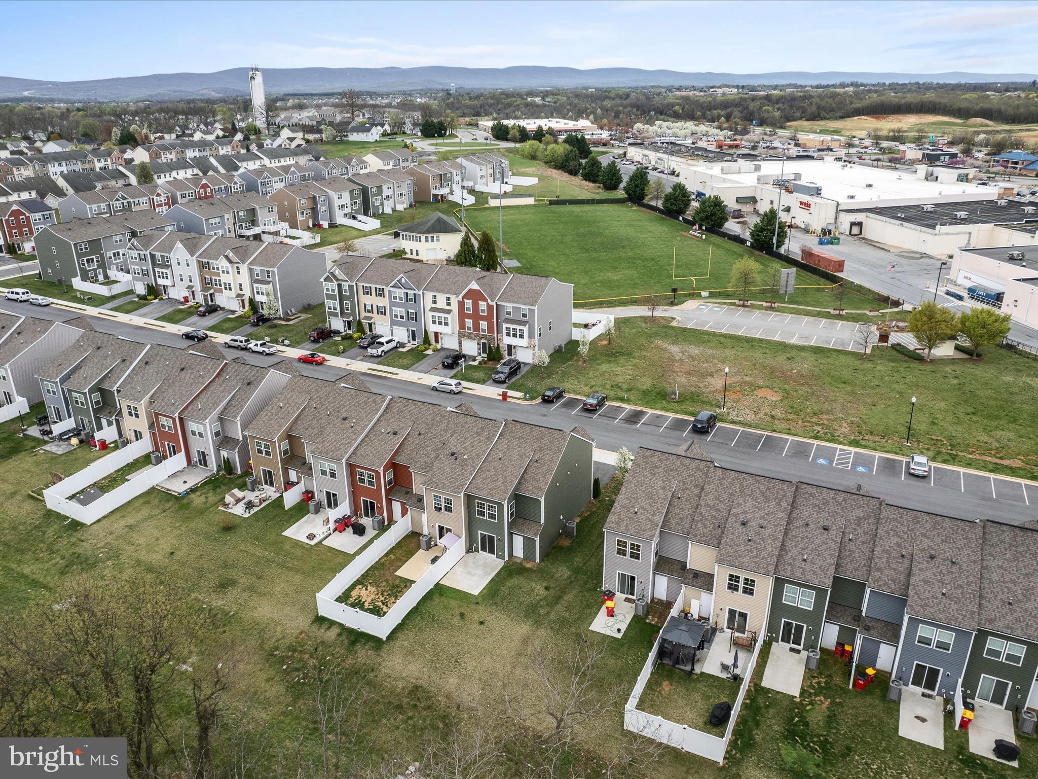 640 Thumper Drive Ranson, WV 25438 - Photo 43 of 50 an aerial view of a house with a garden and mountain view in back