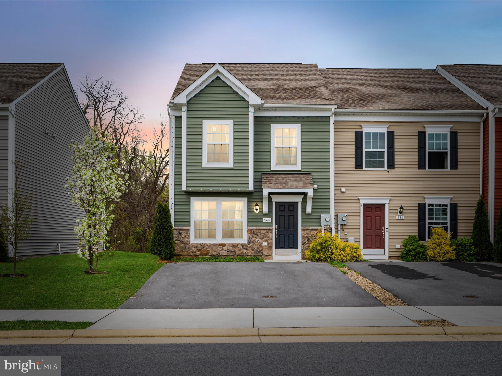 640 Thumper Drive Ranson, WV 25438 - Photo 46 of 50 a front view of a house with a garden and trees
