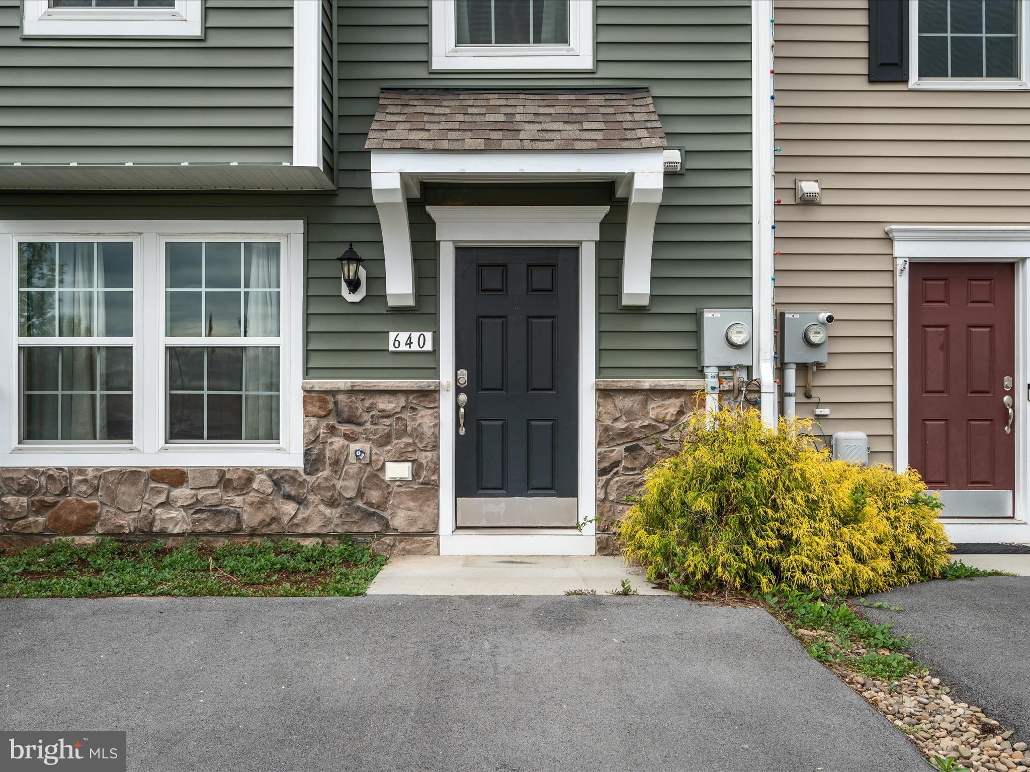 640 Thumper Drive Ranson, WV 25438 - Photo 6 of 50 a front view of a house with a garden