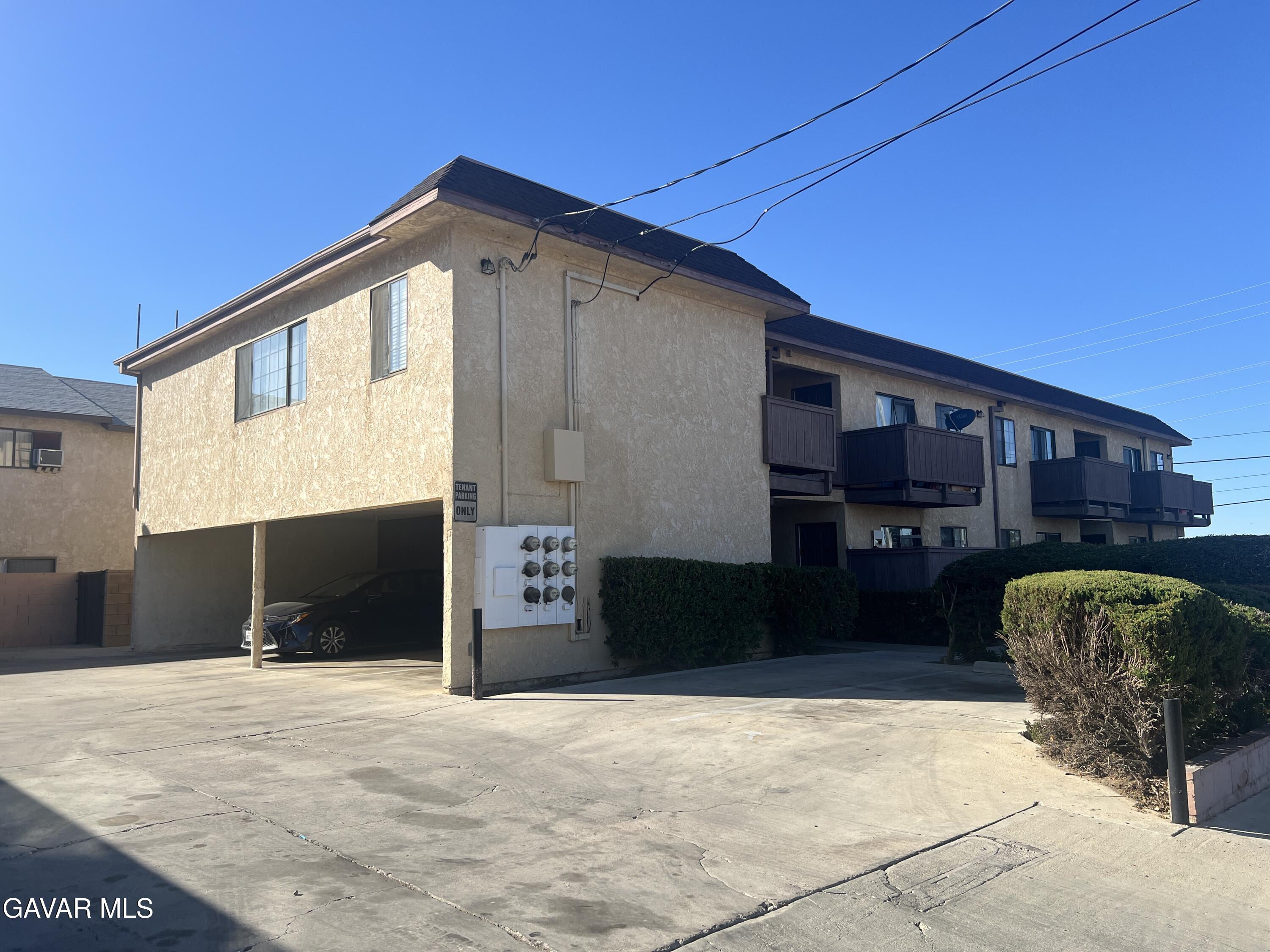 4202 West Ave L, Unit 7 Quartz Hill, CA 93536 - Photo 1 of 14 a front view of a house with a yard