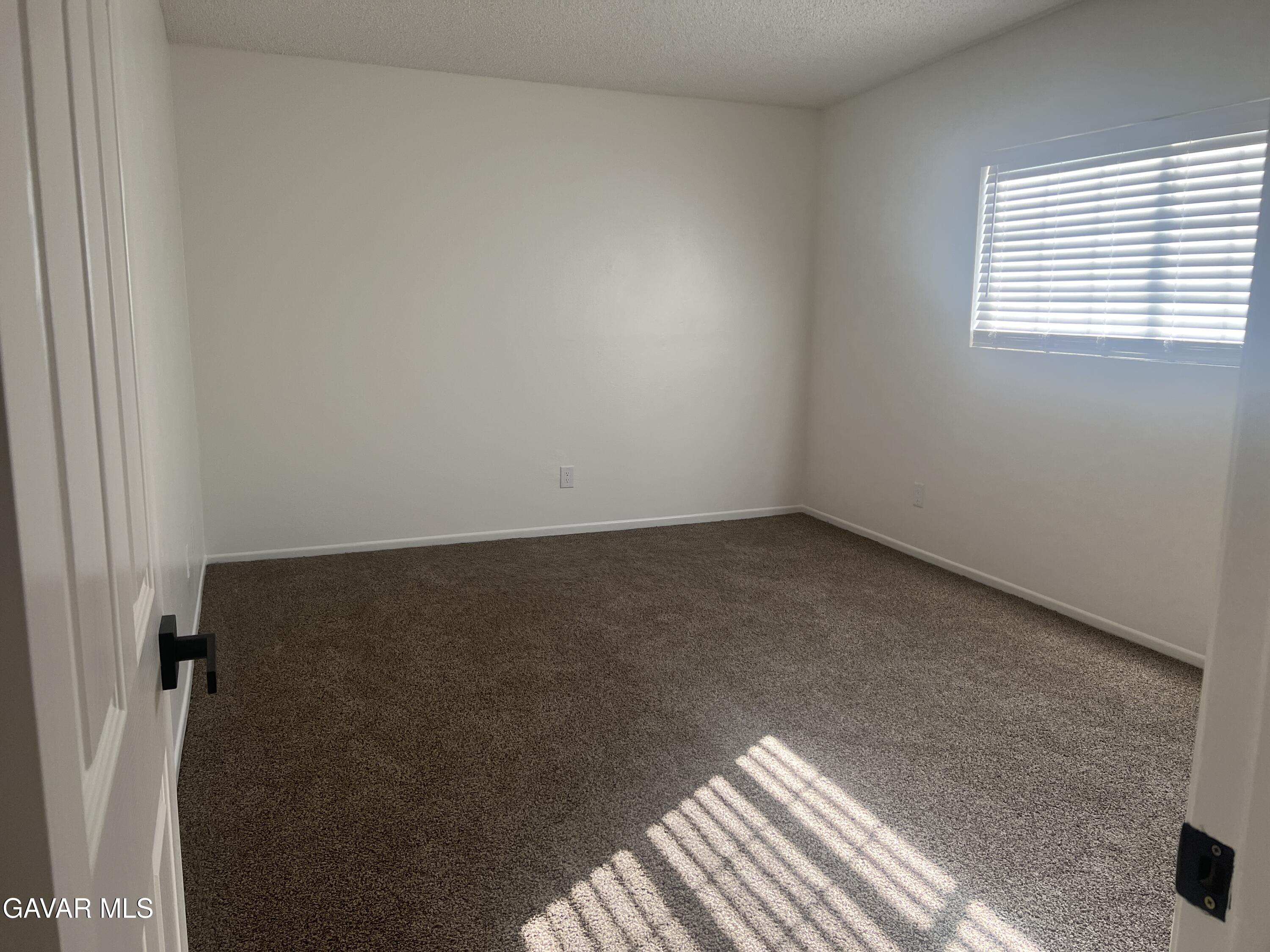 4202 West Ave L, Unit 7 Quartz Hill, CA 93536 - Photo 11 of 14 an empty room with a window