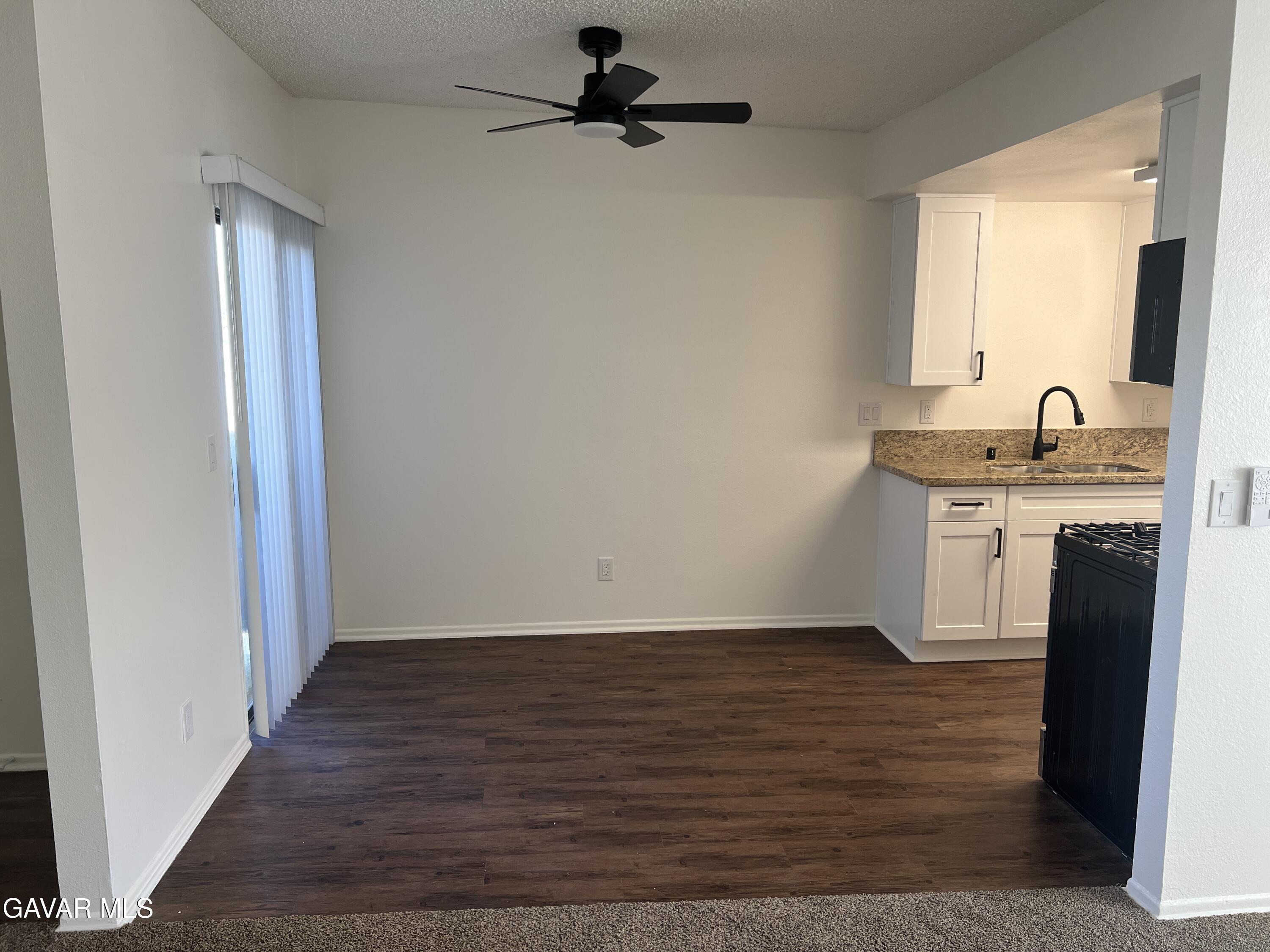 4202 West Ave L, Unit 7 Quartz Hill, CA 93536 - Photo 6 of 14 a view of a kitchen from the hallway