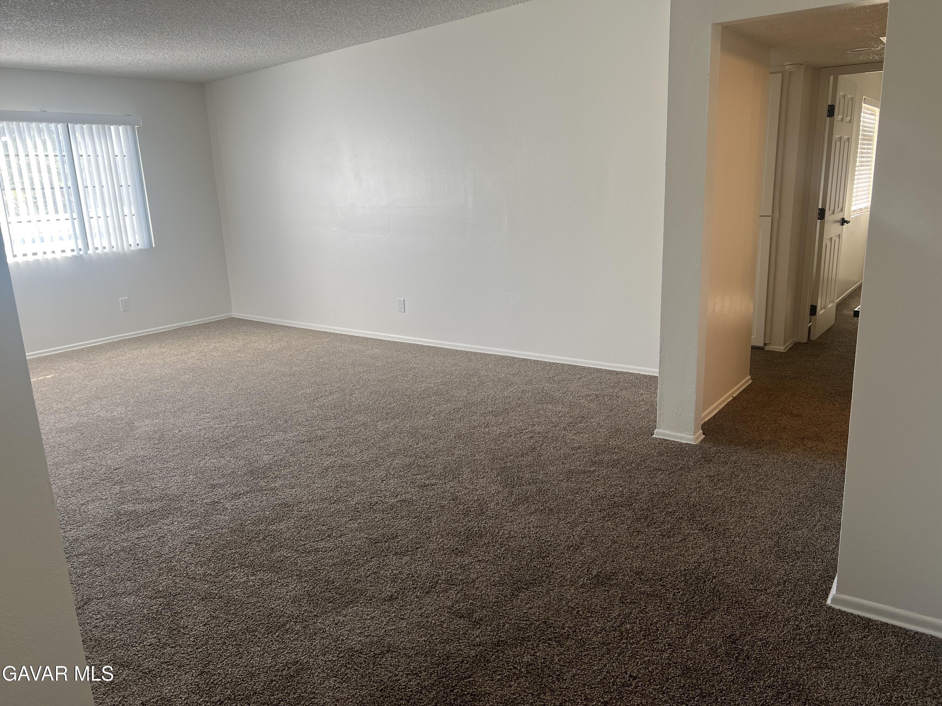 4202 West Ave L, Unit 7 Quartz Hill, CA 93536 - Photo 9 of 14 an empty room with windows