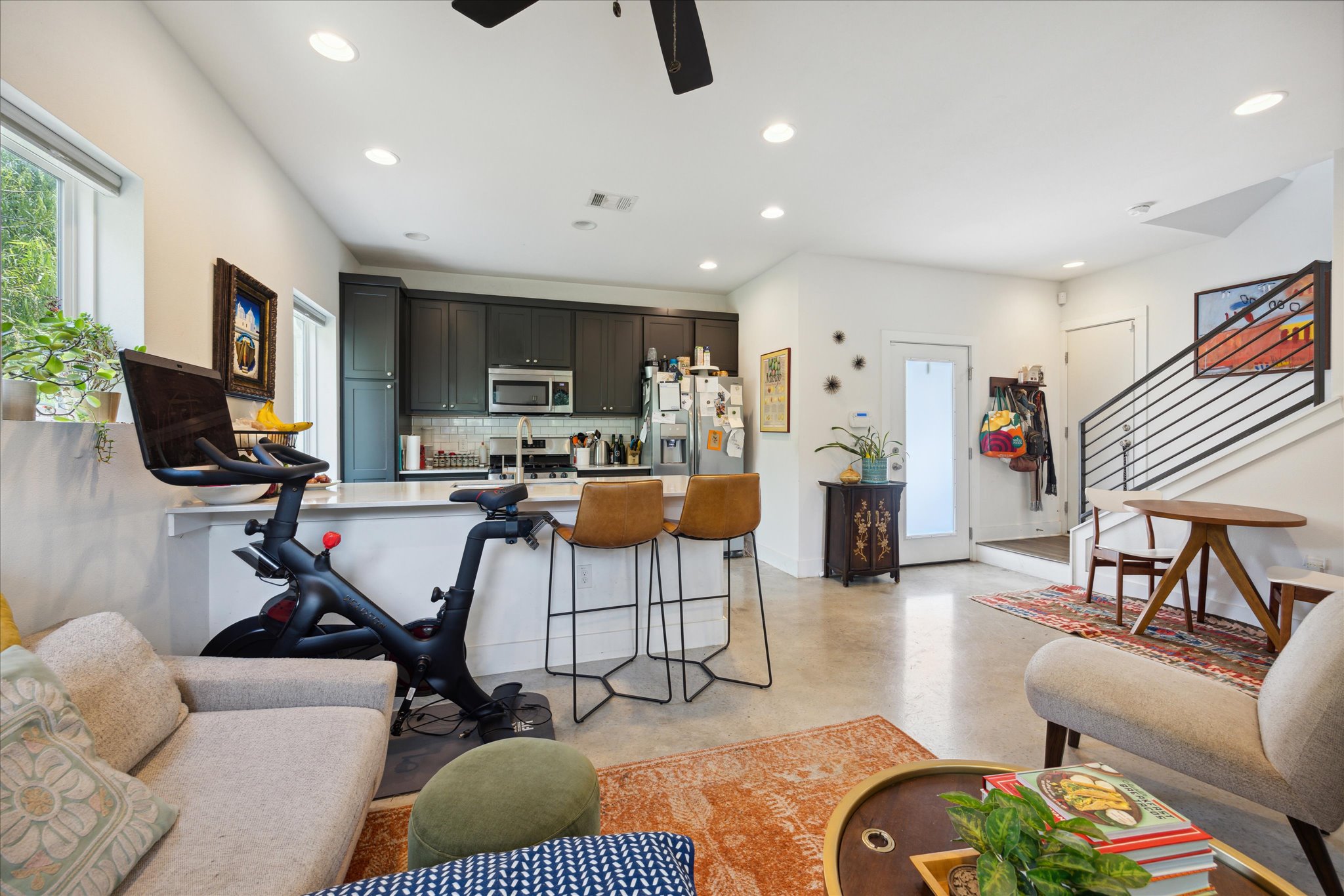5006 Baker Street, Unit B Austin, TX 78721 - Photo 5 of 16 a living room with furniture and a flat screen tv