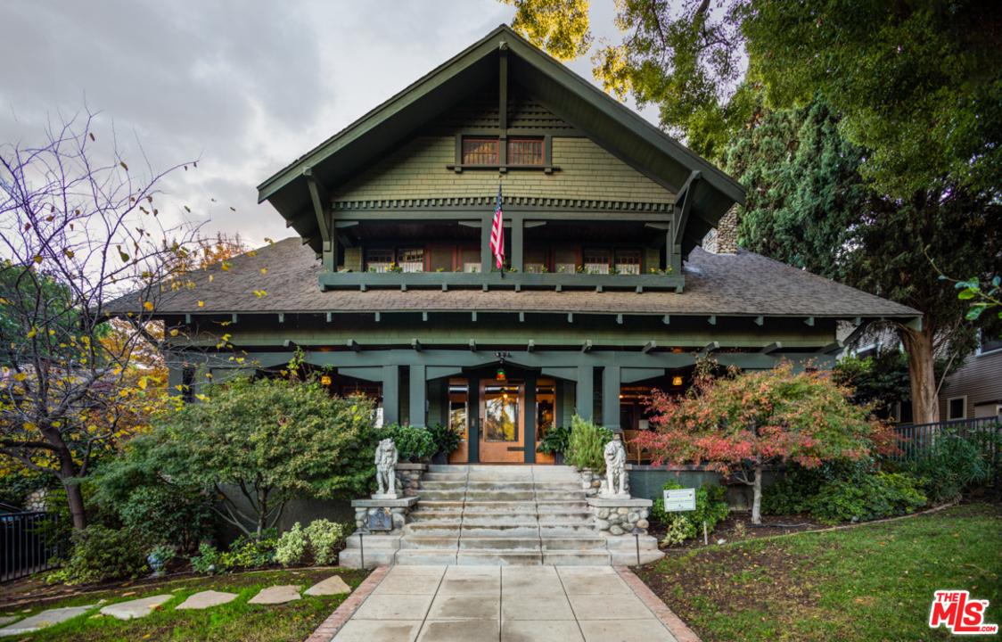 4570 University Avenue Riverside, CA 92501 - Photo 1 of 40 a front view of a house with garden