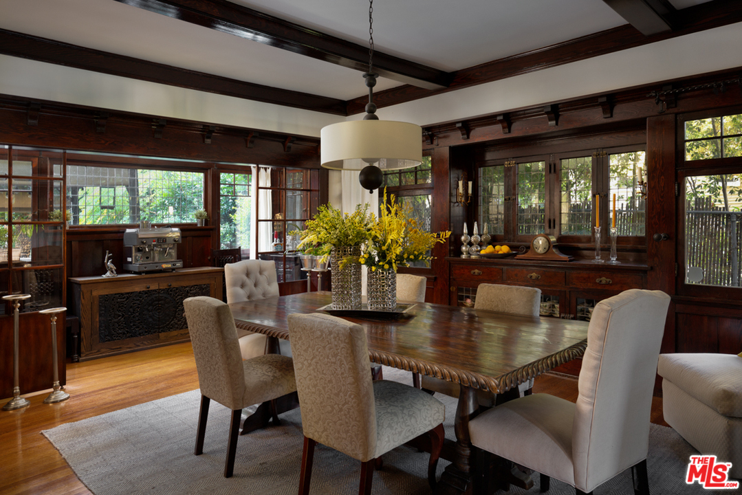 4570 University Avenue Riverside, CA 92501 - Photo 14 of 40 a dining room with furniture wooden floor and a chandelier