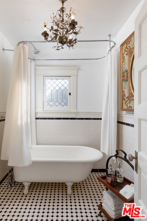 4570 University Avenue Riverside, CA 92501 - Photo 31 of 40 a bathroom with a bathtub and a shower
