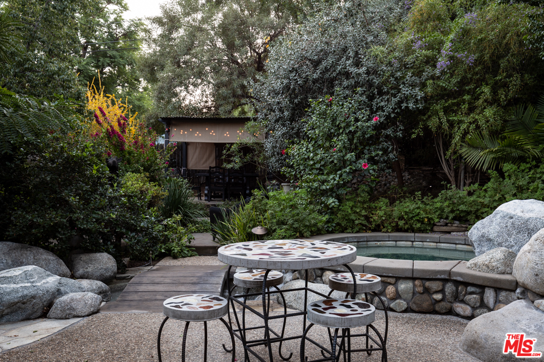 4570 University Avenue Riverside, CA 92501 - Photo 35 of 40 a backyard of a house with table and chairs