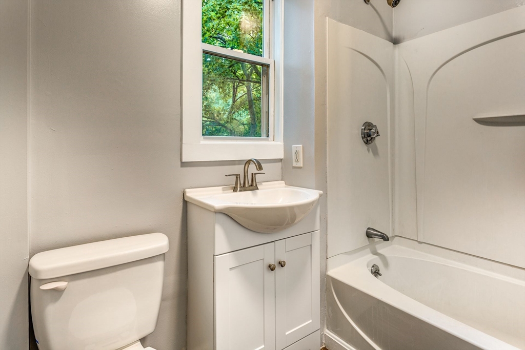 10 Winter Street, Unit 3 Boston, MA 02110 - Photo 7 of 7 a bathroom with a sink toilet and shower