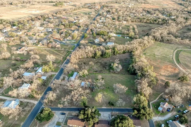 an aerial view of house with yard