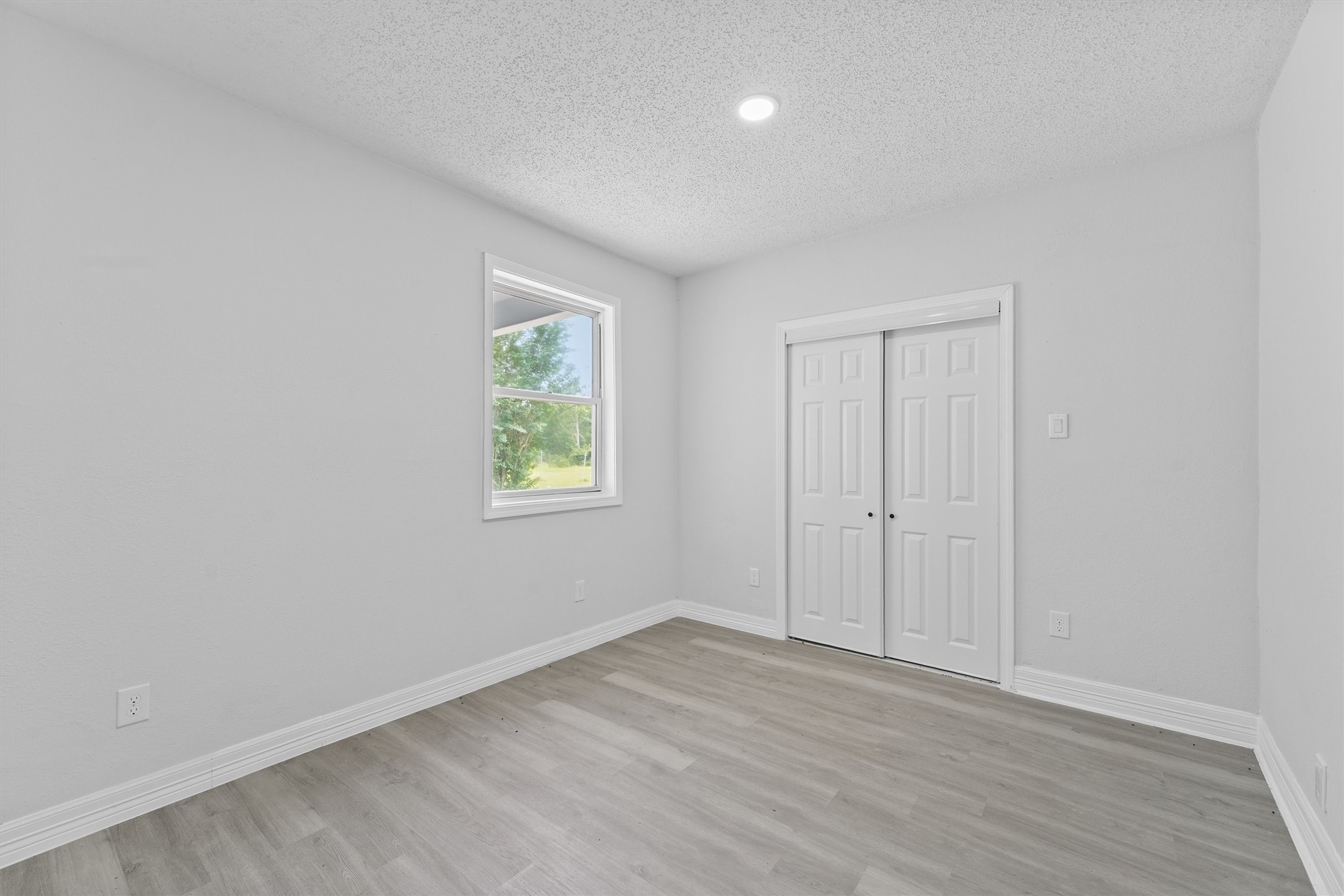 1615 Hiller Street Houston, TX 77015 - Photo 21 of 26 a view of an empty room with wooden floor and a window