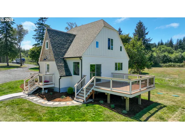 a aerial view of a house with table and chairs