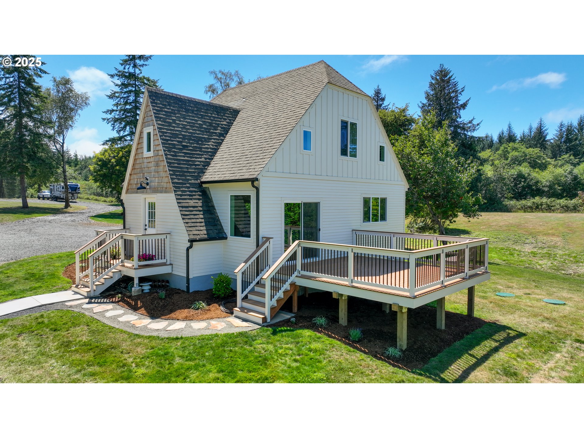 90635 Spring Road Astoria, OR 97103 - Photo 1 of 38 a aerial view of a house with table and chairs
