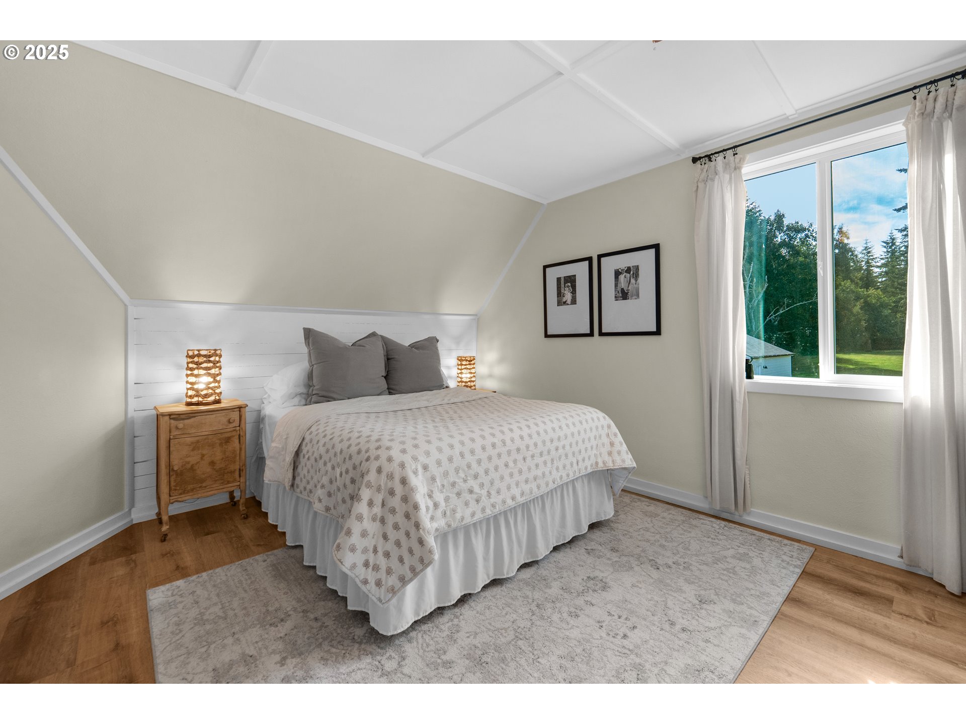 90635 Spring Road Astoria, OR 97103 - Photo 30 of 38 a bedroom with a bed and a large window