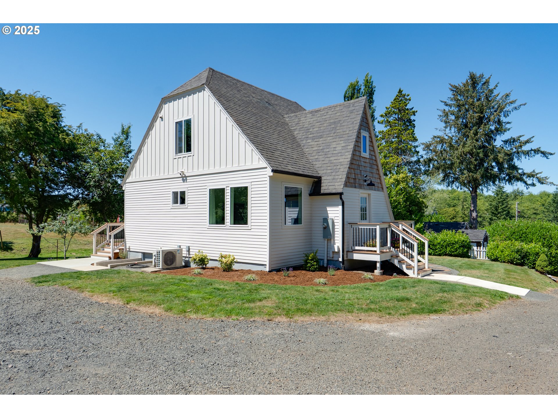 90635 Spring Road Astoria, OR 97103 - Photo 3 of 38 a view of a house with a yard and large tree