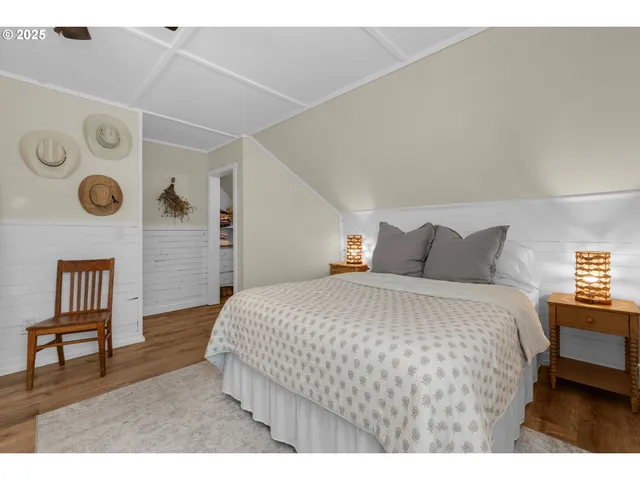 a bedroom with a bed and a table with closet