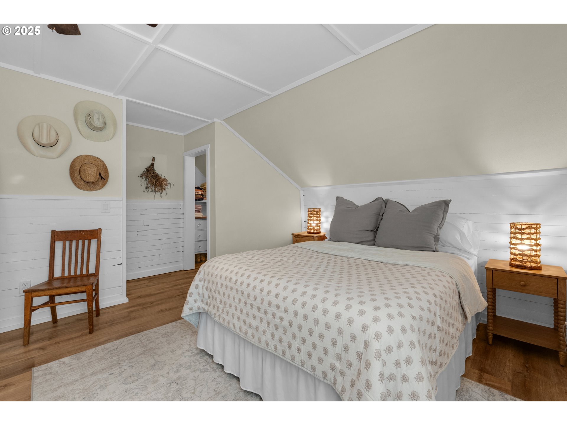 90635 Spring Road Astoria, OR 97103 - Photo 31 of 38 a bedroom with a bed and a table with closet