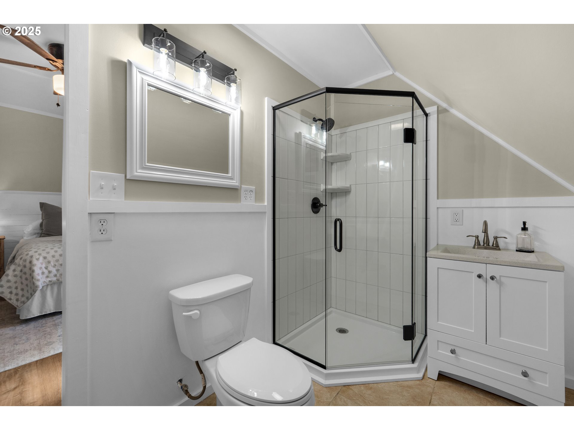 90635 Spring Road Astoria, OR 97103 - Photo 33 of 38 a bathroom with a shower a mirror and a sink