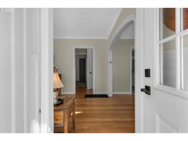 a view of an entryway with wooden floor