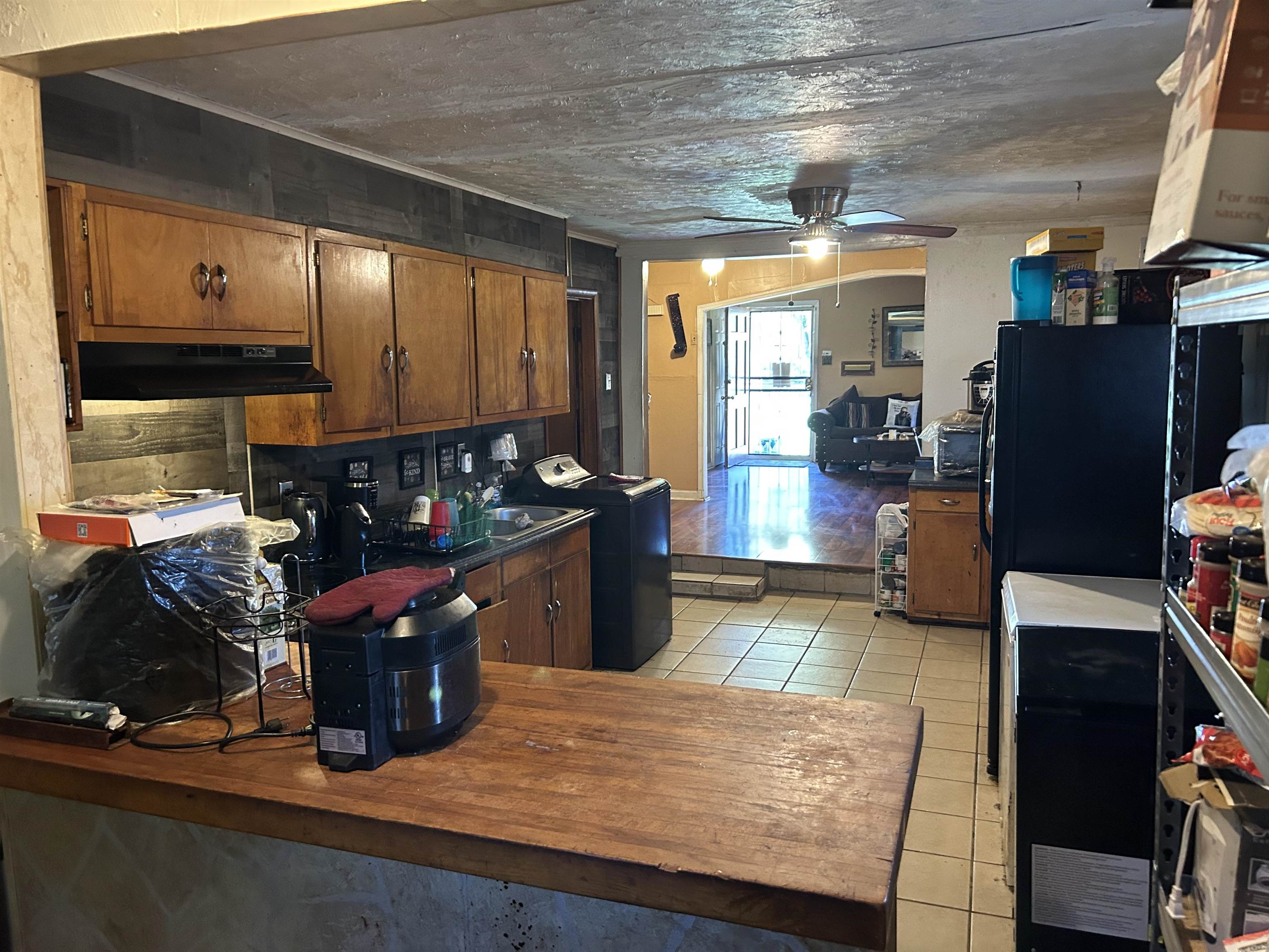 3158 Ford Road Memphis, TN 38109 - Photo 10 of 22 a kitchen with stainless steel appliances granite countertop a sink counter space and wooden floor