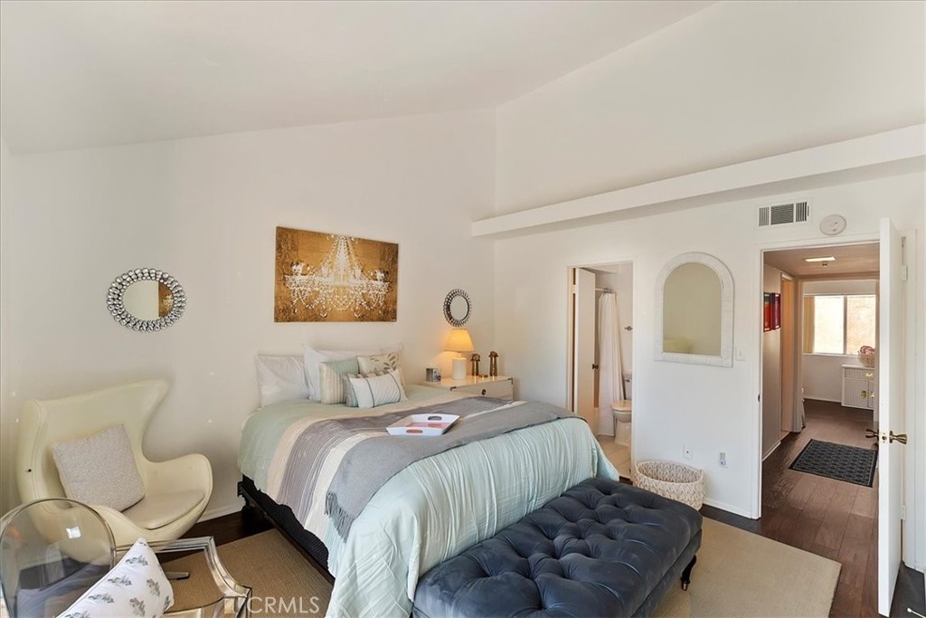 82297 Cochran Drive Indio, CA 92201 - Photo 13 of 32 a bedroom with a bed and wooden floor