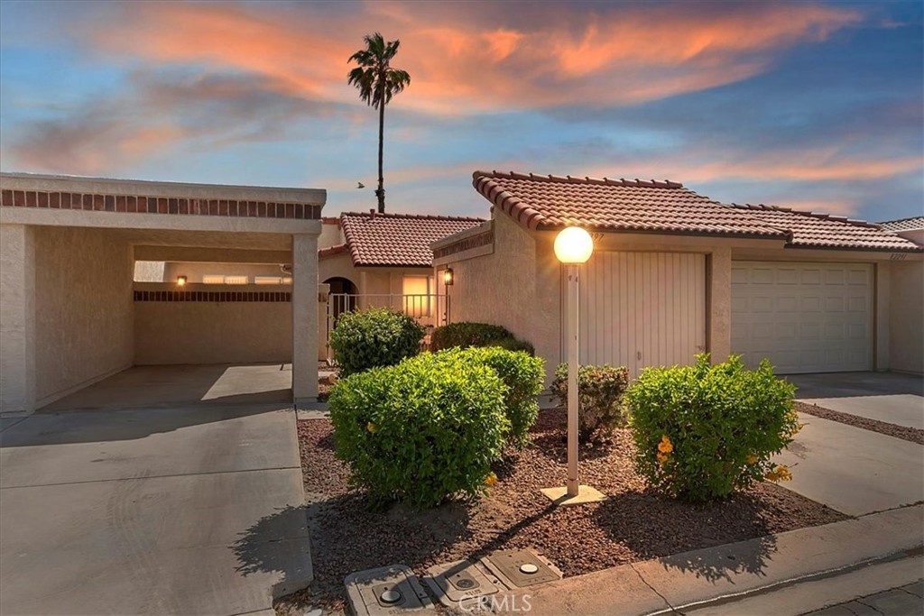 82297 Cochran Drive Indio, CA 92201 - Photo 19 of 32 a front view of a house with garden
