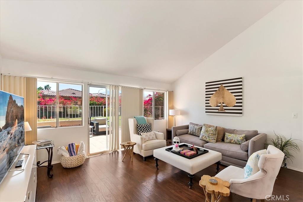 82297 Cochran Drive Indio, CA 92201 - Photo 5 of 32 a living room with furniture and a flat screen tv