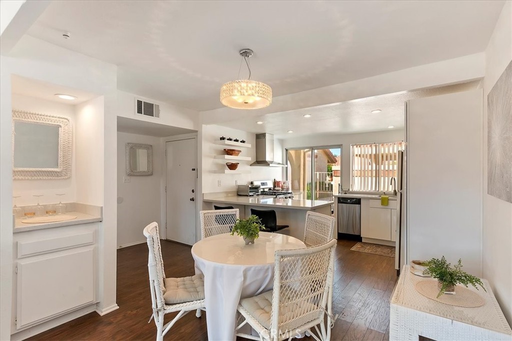 82297 Cochran Drive Indio, CA 92201 - Photo 7 of 32 a large kitchen with a table and chairs