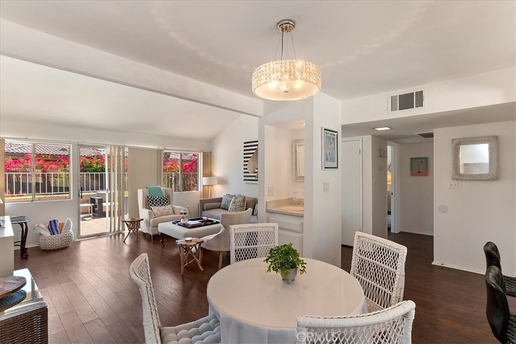 82297 Cochran Drive Indio, CA 92201 - Photo 9 of 32 a living room with furniture kitchen and a chandelier