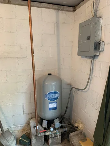 a bathroom with a shower a toilet and a sink