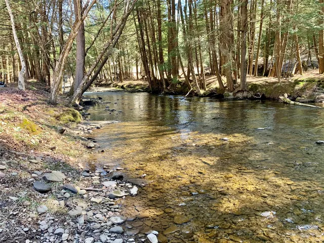 a view of a large body of water with water fall