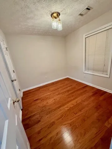 a view of empty room with ceiling fan